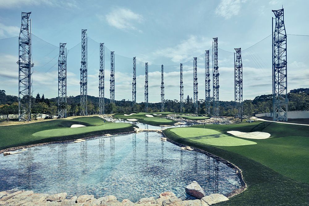 Kennewick Synthetic grass golf course with water and tall metal towers